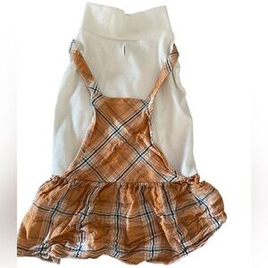 Fall plaid dog dress in pumpkin  orange and cream .